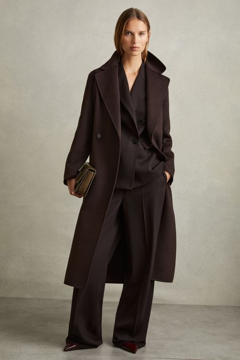 Find REISS Lucia Wool Blend Double Breasted Blindseam Coat on Editorialist. Crafted from a smooth wool blend and arranged in a blindseam construction, this long coat is fitted with oversized lapels and a self-fabric waist belt. This blindseam coat is crafted using double-faced, splitable wool for a supremely soft interior that matches the exterior, removing the need for a lining. Wool blend Self-tie waist belt Vent to reverse Relaxed fit