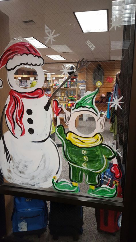 Window art done by kmaria arts in soldotna alaska Window Art For Christmas, Holiday Window Art Ideas, Library Window Painting, Snowmen Window Painting, Funny Christmas Window Painting, Santa Window Art, Painted Window Art Christmas, Christmas Window Display Paint, Snowman Window Art