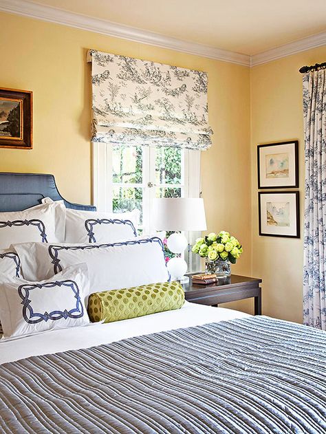 Another tip to getting the most out of your yellow paint color is moving beyond your walls and onto the ceiling. "Whenever I can, I try to put a hint of the wall color on the ceiling," Marlaina says. "It makes the room feel more complete. The color will look darker on the ceiling, so cut it by 50 percent." Yellow Bedroom Walls, Colorful Bedroom Design, Yellow Paint Colors, Yellow Room, Yellow Paint, Yellow Bedroom, Yellow Walls, Bedroom Paint, Bedroom Designs