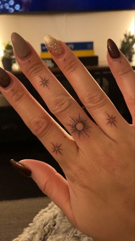 Philippines Sun And Stars Tattoo, Tiny Sun Finger Tattoo, 3 Stars And A Sun Tattoo, Star And Dot Tattoo Filler, Sun On Finger Tattoo, Stars Hand Tattoos For Women, Sunburst Finger Tattoo, Half Sun Finger Tattoo, Sun Hand Tattoos For Women