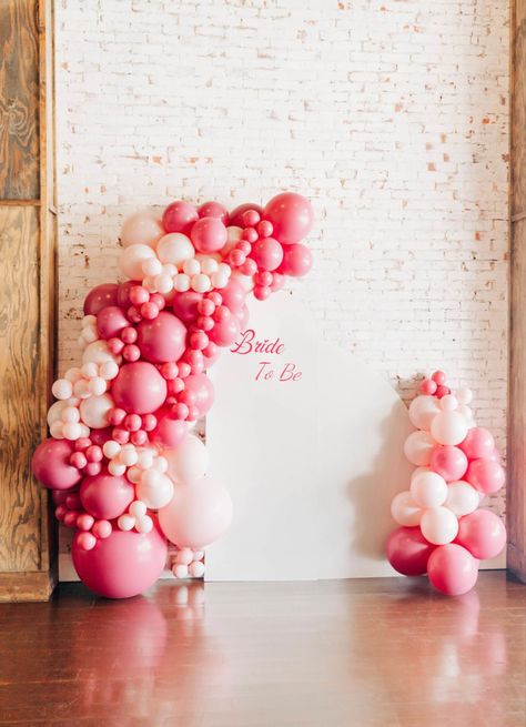 Love Is Sweet Bridal Shower Decorations, Classy Pink Bridal Shower Ideas, Bridal Shower Balloon Arch Pink, Love Themed Bridal Shower Ideas, Showered With Love Bridal Shower Theme, Hot Pink Bridal Shower Decorations, Valentine’s Day Bridal Shower Ideas, Pink And Red Bridal Shower Decor, Bridal Shower Pink And White