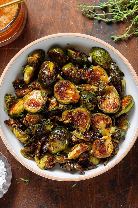 These Honey Balsamic Brussels Sprouts are the perfect balance between sweet and salty. They're crispy, flavorful, and so simple! They're easy enough to be served as a side for a weeknight dinner but they taste fancy enough to be a part of your holiday table! They make a great fall side dish for any occasion. Brussels Sprout Roasted, Fancy Dinner Party Meals, Broccoli Thanksgiving Side Dish, Mediterranean Thanksgiving Sides, Season Brussel Sprouts, Brussels Sprouts In The Oven, Thanksgiving Vegetable Ideas, Brussel Sprout Meal Prep, Thanks Giving Veggies