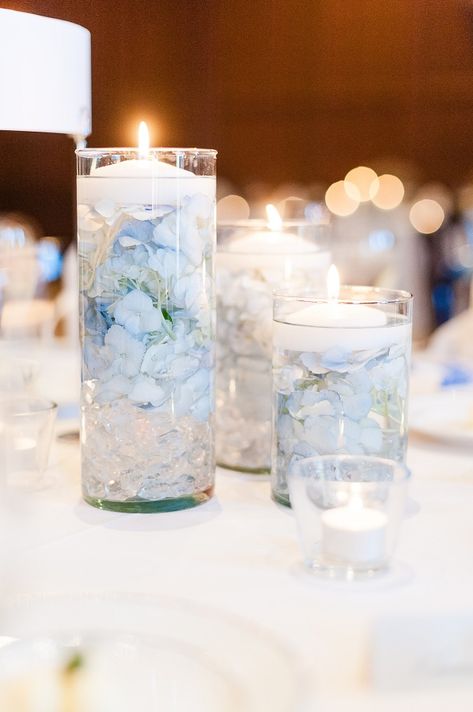 Three vases with floating candles as a table centerpiece with blue flower petals | Leslie Ann Photography | villasiena.cc Vases With Floating Candles, Wedding Decorations Blue, Blue Flower Petals, Baby Blue Weddings, Blue Wedding Centerpieces, Blue Wedding Decorations, Blue Centerpieces, Bridal Shower Inspo, Something Blue Bridal