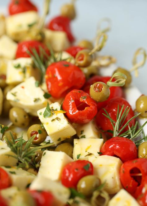 Marinated Cheese & Olive Skewers Cheese Olive Skewers, Cheese Olive Balls, Feta Skewers Appetizers, Appetizer With Olives, Olives And Cheese Appetizer, Olive And Cheese Platter, Olives Appetizer Ideas, Holiday Party Menu Ideas Appetizers, Olive Themed Party