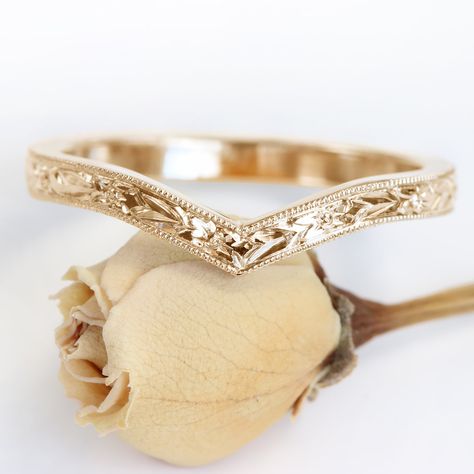 This pretty 18ct rose gold wishbone wedding ring is adorned with a detailed hand engraved orange blossom pattern around the band. The floral design is bordered with a milgrain edging. The 2mm wide x 1.5mm deep wedding band is handmade to order in Lilia's Cornish studio, from ethically sourced solid rose gold Wishbone rings look great on their own or in a ring stack - chevron dip can accommodate our solitaire and trilogy engagement rings (especially the rings with a milgrain setting). Get the per Floral Wedding Bands, Ethical Wedding, Trilogy Engagement Ring, Stacked Wedding Bands, Wedding Band Engraving, Plus Size Rings, Cute Engagement Rings, Engraved Wedding, Chevron Ring