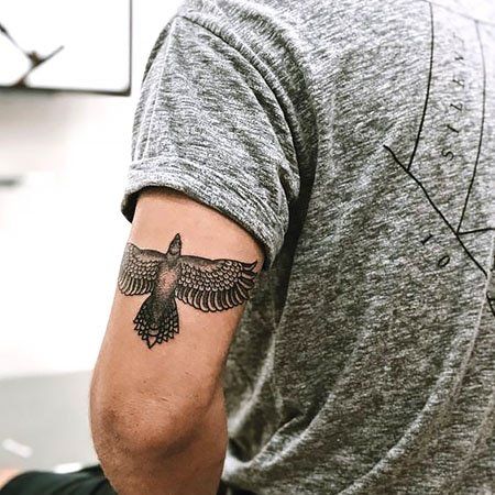 100 Striking Eagle Tattoo Designs for 2022 - The Trend Spotter Eagle Tattoo Back Of Arm, Eagle Tricep Tattoo, Cool Tricep Tattoos For Men, Eagle Tattoo Tricep, Tattoo Ideas Tricep, Tattoo Eagle Arm, Men Tricep Tattoo, Mens Eagle Tattoo, Eagle Tattoo Ideas For Men