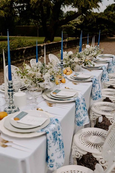 Italian Inspired Wedding Table Decorations with Lemons And A Blue Wedding Theme Blue Plates Table Setting Wedding, Italy Inspired Table Decor, Blue And Yellow Mediterranean Wedding, Blue And White Table Decorations Party, Blue White And Yellow Table Setting, Mediterranean Wedding Table Setting, Mediterranean Wedding Decor Ideas, Mediterranean Blue Wedding Theme, Blue And White Lemon Theme