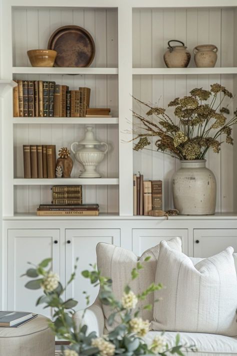 15 Bookshelf Decor Ideas That Will Make You Look Like a Styling Genius Bookshelf Styling Farmhouse, Fall Bookcase Decor Ideas, Bookcase Styling Living Room, Farmhouse Fireplaces, Farmhouse Bookshelf Decor, Decorating Built Ins, Styling Built In Shelves, Bookshelf Decor Ideas, Bookshelf Decorating Ideas