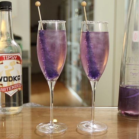 Make sure you have all the bartending tools you need to make these awesome drinks: https://www.amazon.com/shop/tipsybartender  Champagne cocktails don't get much prettier than this New Year's Purple Shimmering Champagne. This delicious 2019 New Year's Eve Champagne cocktail mixes up vodka, Purple Viniq, champagne, corn syrup, silver sugar, and Purple Rock Candy, and delivers sweet, bubbly tastiness with every sip. Vodka Mixers, Champagne Margaritas, New Year's Drinks, Champagne Recipes Cocktails, Champagne Punch, Purple Cocktails, Purple Drinks, Candy Cocktails, Champagne Drinks