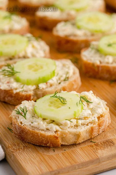 Cucumber Bruschetta is a fantastic light and creamy appetizer, topped with refreshing cucumbers that are simple to make and disappear so fast! #Realhousemoms #cucumber #bruschetta #italian #bread #baguette #mayo #creamcheese #italiandressingmix #snack #kidapproved #summersnack #appetizer Cucumber Bruschetta Recipe, Little Bread Appetizers, Cucumber Baguette Appetizer, French Bread Appetizers Simple, Baggett Bread Appetizer, Baquette Bread Appetizers, French Baguette Recipe Appetizers, Appetizer Baguette, Cucumber Bruschetta