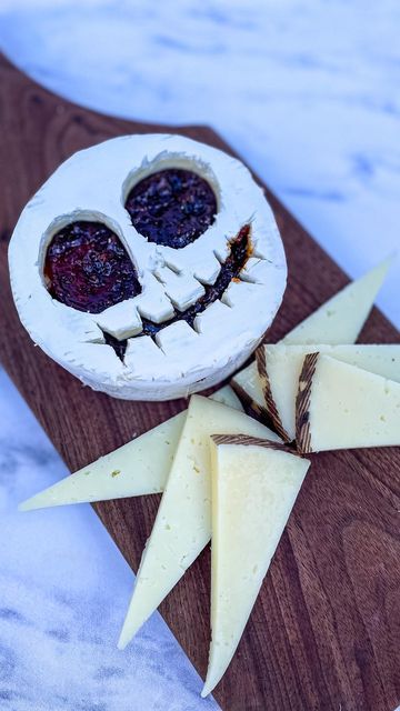 MakeFoodLovely CT Charcuterie on Instagram: "halloween series: don’t brie scared ⁣ ⁣ over the next three weeks, I will be posting classic spookiness, having taken cheese form ⁣ ⁣ part one: the pumpkin king himself, ⁣ jack skellington ⁣ ⁣ the nightmare before christmas had escaped me in childhood, but my son found it on @disneyplus and we have been watching it on repeat for weeks. quick tip: it helps to work with very cold brie when carving out the face, but best to serve after having sat out f Brie Skull Charcuterie, Halloween Bree Cheese, Skull Brie Cheese, Spooky Brie Cheese, Skeleton Brie Cheese, Spooky Baked Brie, Halloween Brie Cheese Ideas, Nightmare Before Christmas Food Recipes, Jack Skellington Charcuterie Board