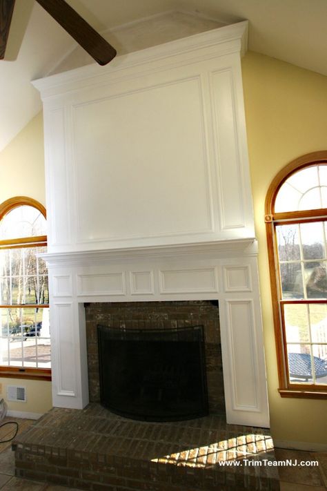 Love the paneling, height and crown molding in this fireplace & mantel. Crown Molding Fireplace Mantle, Wood Molding Fireplace Surround, Fireplace Trim Ideas Moldings Wood, Chevron Molding Fireplace Overmantel, Corner Fireplace Surrounds And Mantels, Wall Molding Living Room, Above Fireplace Ideas, Tall Ceiling Living Room, Fireplace Molding