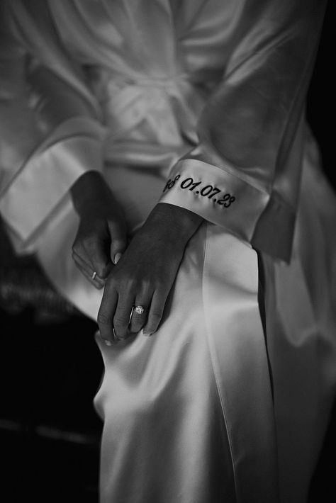 embroidered wedding date on the cuff of the brides satin getting ready robe Wedding Morning Candle, Wedding Robes Getting Ready Satin, Wedding Photography Getting Ready The Bride, Bridal Morning Photoshoot, Wedding Morning Aesthetic, Wedding Morning Photos, Getting Ready Pictures Wedding, Wedding Detail Photography, Bridesmaid Robe Pictures