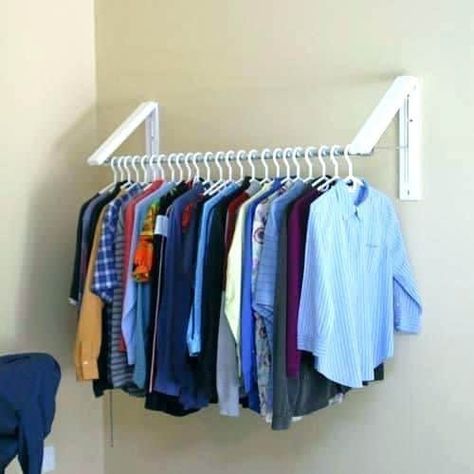 Do you get frustrated at the clutter and lack of space in your small bedroom and closet? Are you trying to downsize or move to a more minimalist lifes... | Use Hanging Brackets to Put Up Clothes #smallbedroom #bedroom #bedroomorganization Clothes Storage Solutions, Clothes Storage Systems, Clothes Hanger Storage, Small Bedroom Organization, Small Laundry Room Organization, Diy Clothes Rack, Room Storage Diy, Clothes Closet Organization, Clothes Hanging