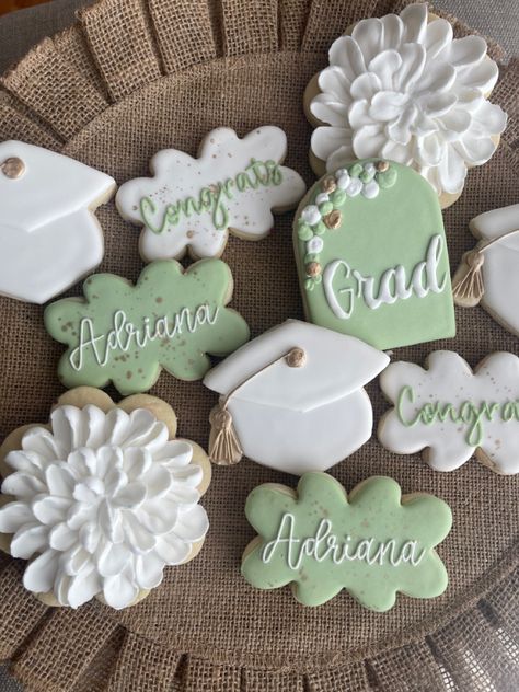 Floral Grad Cookies, 70s Graduation Party Ideas, Graduation Party Foods Ideas, Graduation Party Ideas Sage Green, College Themed Graduation Party, Sage Green Gold And White Graduation Party, Flower Graduation Cookies, Graduation Party Ideas Aesthetic Green, Sage Green Grad Party Decor