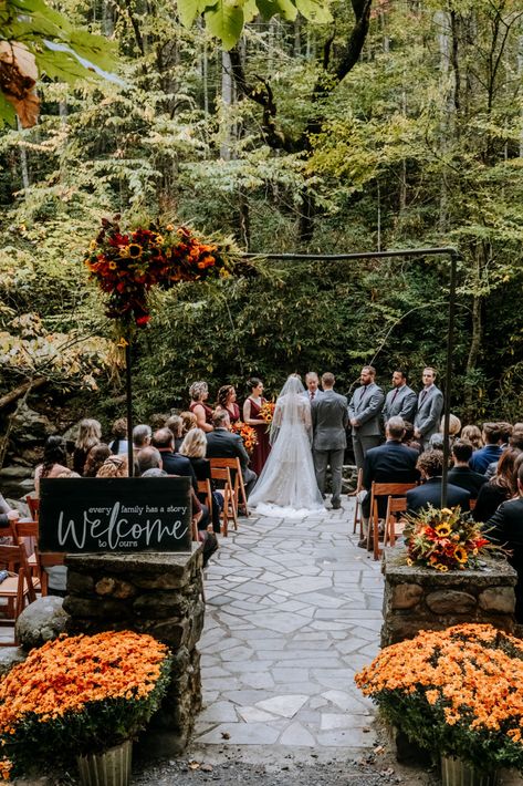 Bright oranges, yellows, reds and purples in the flowers | Huge orange mums | Wood welcome sign | Echelon Florist | Smoky Mountain Wedding | National Park Wedding | Fall Wedding | Spence Cabin Ceremony | Appalachian Clubhouse Reception | Derek Halkett Photography | Absolute Wedding Perfection Mums Fall Wedding, Mums Flowers Wedding Decor, Mums At Wedding Ceremony, Fall Foliage Wedding Decor, Tennessee Orange Wedding, Fall Wedding Pergola, Fall Wedding Venue Decor, Fall Wedding Elopement Ideas, Tennessee Fall Wedding