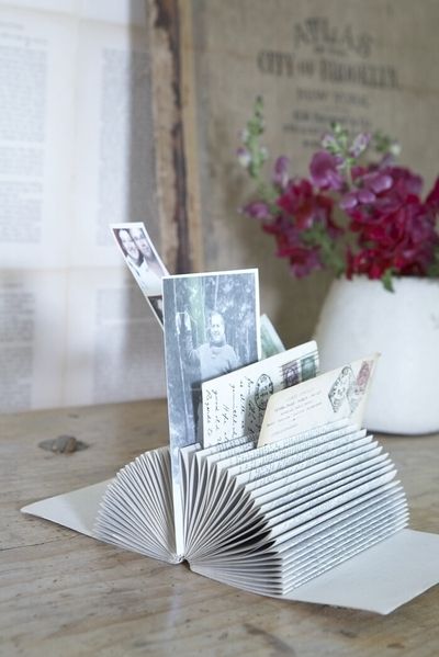 Organize - Turn a book into a picture/card/bill holder from DIY Design Community.  #picture #holder #DIY #organize #bills #cards Stary Papier, Diy Mail, Old Book Crafts, Recycled Books, Folding Origami, Book Page Crafts, Folded Book Art, Book Sculpture, Picture Holders