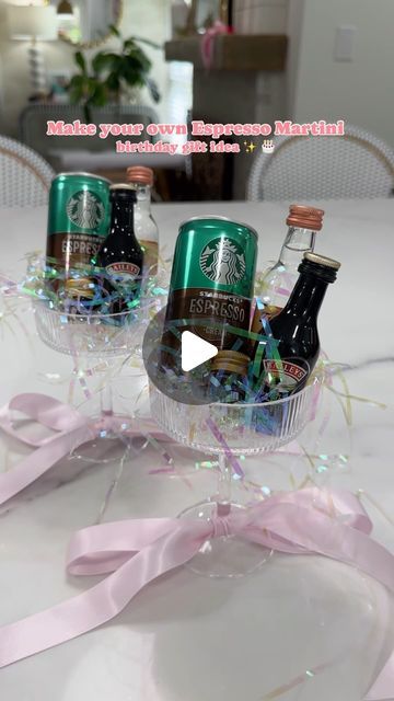 Amber Capps on Instagram: "A make your own espresso martini gift idea✨  I bought a set of coupe glasses from Amazon, tied a ribbon around the bottom of the glass + filled them with irredescent crinkle paper.   I used mini glass bottles and filled them with espresso beans to garnish with, added a can of espresso, mini bottles of vodka and coffee liqueur (I used Bailey’s because it’s the closet I could find in a mini bottle - I would normally use Kahlua ☕️) to each glass.   They were the perfect birthday gift for 2 of my friends who love espresso martinis! (+ so easy to make!)  . . . . . . #espressomartini #espresso #giftideas #giftideasforher #amazongiftideas #amazongiftideas #birthdaygifts #martinicocktail #giftsforher #easygiftideas #coupeglass #amazonfinds" Mini Cocktail Gifts Party Favors, Martini Glass Gift Ideas, Holiday Drink Gift Ideas, Mini Baileys Bottle Gift, Espresso Martini Wedding Favours, Cute Work Gift Ideas, Cute Drink Gift Ideas, Expresso Martini Gift Ideas, Diy Cocktail Gifts Ideas