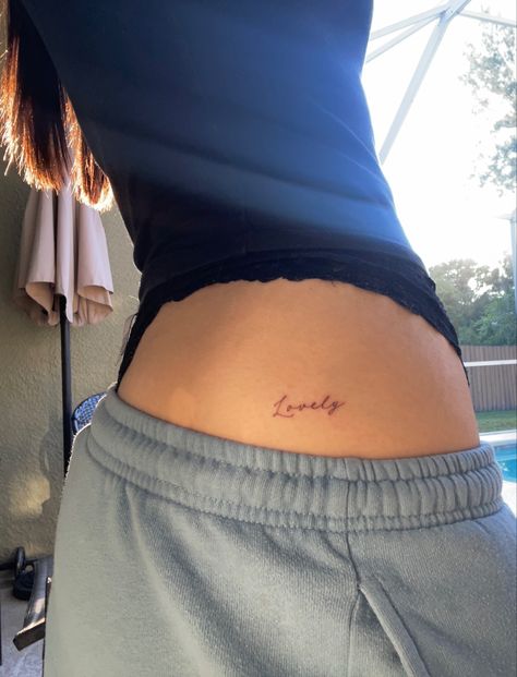 Dainty tattoo Dainty Tattoos Thigh, Dainty Tattoo Spots Women, Tattoos Girls Aesthetic, One Word Cursive Tattoo, Dainty Words Tattoo, Divine Lower Back Tattoo, Dainty First Tattoos, Cutie Tattoo Simple, Above Hip Tattoos Women