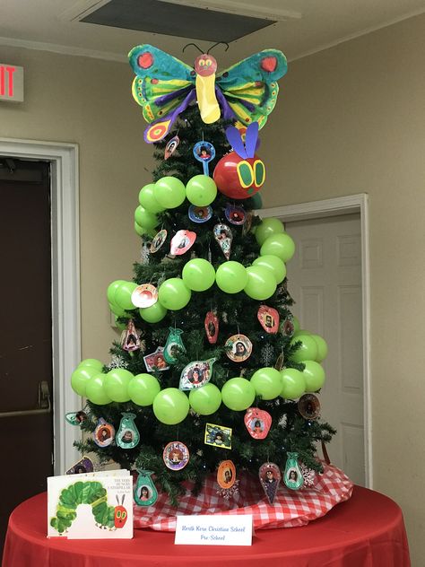 The Very Hungry Caterpillar Christmas Tree Library Themed Christmas Tree, Class Christmas Tree Ideas, Storybook Christmas Tree, Work Christmas Tree Themes, Cheap Christmas Tree Decor, Kids Christmas Tree Themes, Festival Of Trees Ideas, Library Christmas Tree, School Christmas Tree