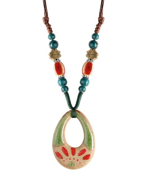 PRICES MAY VARY. UNIQUE DESIGN: Discover the unique charm of this bohemian necklace, featuring a handcrafted ceramic pendant with an abstract nature-inspired design, perfect for adding a touch of artistic flair to your jewelry collection. VIBRANT CERAMIC & METAL BEADS: Adorned with a harmonious blend of polished ceramic beads in earthy green and fiery orange hues, and accented with antique bronze leaf charms, this necklace celebrates the spirit of Mother Nature. ADJUSTABLE CORD: The sturdy, intr Indie Gifts Ideas, Ceramic Jewelry Ideas, Aesthetic Clay Jewelry, Earthy Gifts, Jewellery Ceramic, Hippy Necklace, Nature Ceramics, Funky Necklaces, Unconventional Jewelry