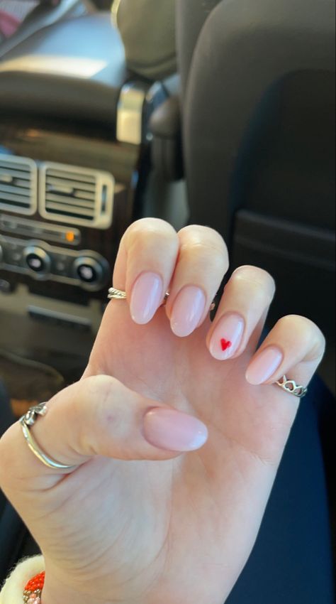 Valentine Nails Natural, Soft Pink Nails With Heart, Pink Nails Heart On Ring Finger, White Almond Nails With Pink Heart, Clear Nails With Heart Design, Nails With One Heart On Ring Finger, Pink Nail Red Heart, Tiny Red Heart Nails, Light Pink Red Heart Nails