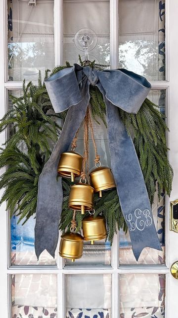 Victorian Christmas Front Door, Wreath In Window Christmas, Wreath With Ribbons Hanging Down, Christmas Wreath Windows, Wreath With Houses, Wreaths For Windows Outside, Window Wreaths Christmas Outdoor, Outdoor Christmas Wreaths On Windows, Mirror With Wreath