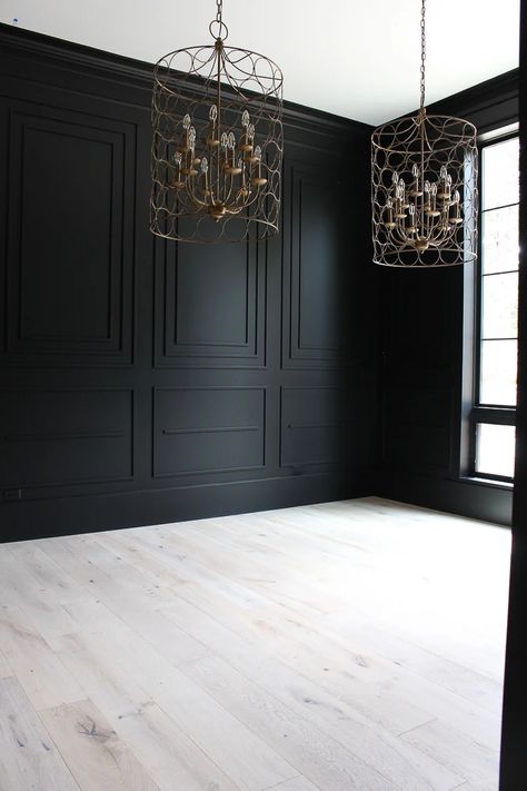 Are you looking for the perfect shade of black paint for an accent wall, kitchen island or even just your front door? Whether you want to go bold with all over color or just as a touch of contrast, Sherwin Williams Tricorn Black is one of the best shades of black paint. Read this full paint review to see if it's the right color for your home! White Floor Black Walls, Black Panelling Dining Room, Black Wall Design Living Room, Light Oak Floors Dark Walls, Wall Niche Behind Tv, Close Off Dining Room French Doors, Black Crown Molding Bedroom, Manly Bathroom Wallpaper, Tricorn Black Wainscoting