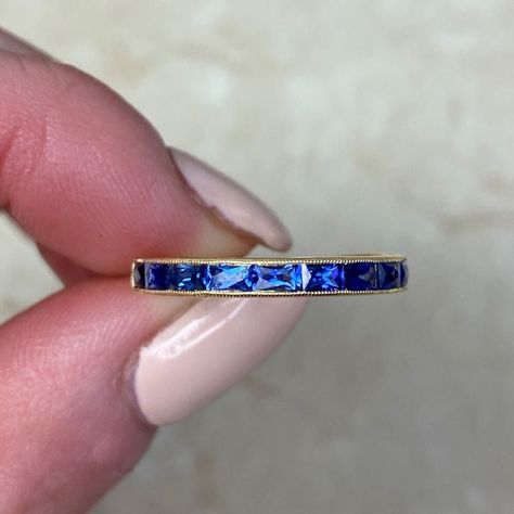 This gorgeous half-eternity band is crafted in 18k yellow gold, featuring elongated French-cut sapphires with a combined weight of 0.84 carats. The channel setting is adorned with delicate milgrain along its edges, and the band measures 2.7mm in width. ✦ GEMSTONE SPECIFICATIONS:  Center Stone: Sapphire  Sapphire Cut: French Cut ✦ WEDDING BAND SPECIFICATIONS: Material: 18K Yellow Gold Stones: Sapphire Band Width: Approx  2.6mm in Width ✦ WHAT COMES IN YOUR SHIPMENT: - Your Wedding Band - Quality Eternity Band Set, Estate Diamond Jewelry, Sapphire Eternity Ring, Emerald Band, Wedding Band Styles, Sapphire Wedding Band, Channel Setting, Sapphire Band, Yellow Gold Wedding Band