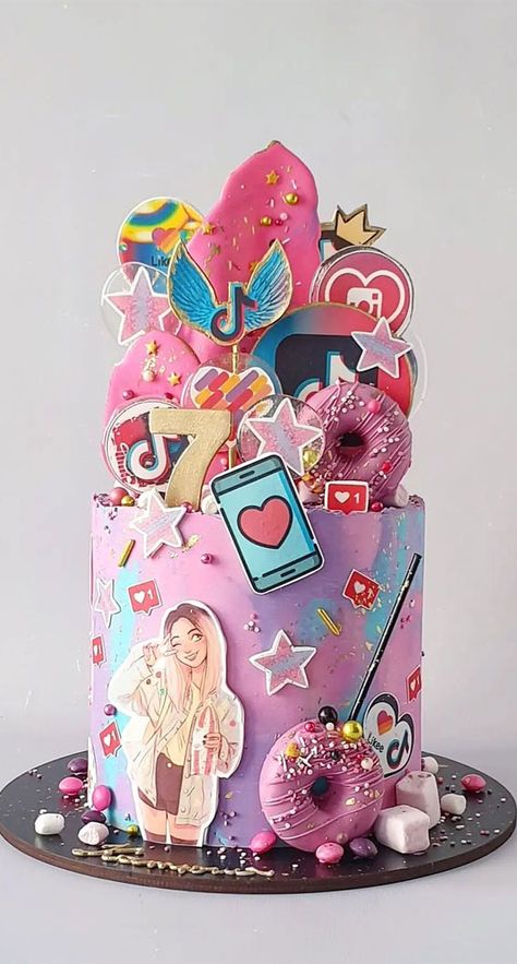 39. Tik Tok Birthday Cake for 7th Birthday When you start planning any party, you want to be creative—whether it is your decoration, dress,... Double Digit Birthday Ideas Daughters, Tik Tok Birthday Cake, Tom Cake, Tik Tok Birthday, Emoji Birthday Cake, Cake Designs For Girl, Cake Design Ideas, 7th Birthday Cakes, Teen Cakes