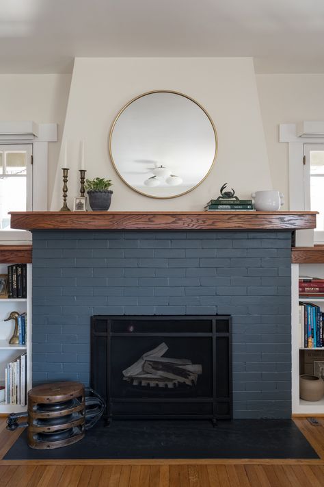 Painted brick fireplace Dark Blue Brick Fireplace, Navy Fireplace Brick, Navy Blue Brick Fireplace, Tudor Revival Fireplace, Fireplace Colors Painted, Green Painted Fireplace, Painted Brick Chimney, Blue Fireplace Wall, Blue Painted Fireplace