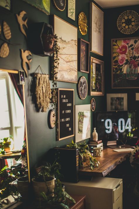 Bohemian Jungle Office Inspiration | vaughan-house.com Cluttercore Office, Jungle Theme Bathroom Ideas Master Bedrooms, Hipster Office Decor, Dark Wall Aesthetic Bedroom, Cozy Art Room Ideas, Slytherin Living Room Ideas, Bohemian Witch Decor, Hiker Home Decor, Moody Eclectic Office