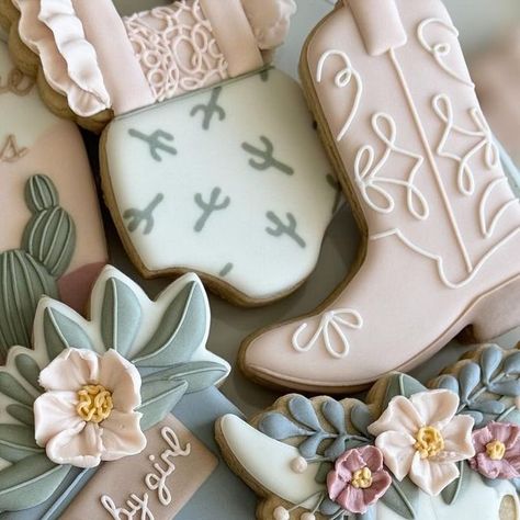 Kendall Jones on Instagram: "A little cowgirl is on the way!🌵  #cowgirlcookies #cowgirlbabyshowercookies #cactuscookies  #sugarcookies #sugarcookiesofinstagram #decoratedcookies" Boots And Bows Cookies, Cowgirl Baby Shower Cookies, Cowgirl Cookies Decorated, Western Cookies Decorated, Kendall Jones, Cowgirl Cookies, Painted Cookies, Cowgirl Baby Showers, Cowboy Cookies