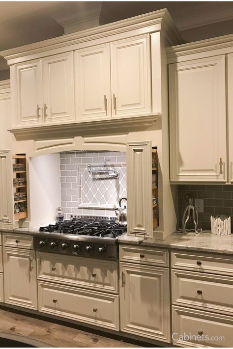 This traditional kitchen’s hearth hood and spice pullouts offer both convenience and style. Colonial Kitchen Ideas, Ivory Kitchen Cabinets, Vanilla Kitchen, Ivory Cabinets, Beige Kitchen Cabinets, Granite Kitchen Countertops, Ivory Kitchen, Traditional Kitchen Cabinets, Beige Backsplash