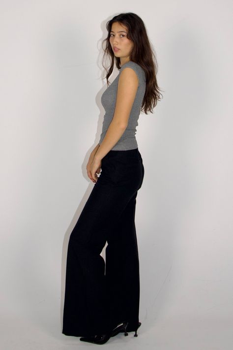 These wide-leg trousers are crafted to fit various body shapes and sizes, enhancing comfort and adding style to your appearance Features Designed to accentuate your curves and showcase the natural contours of your body. Cinch waistband design that ensuring you look and feel your best without compromising on fashion Crafted from a smooth fabric, they gracefully embrace your figure, highlighting your shape. This material is lightweight and airy, ideal for the warmer seasons of spring and summer. The high-waisted design with wide-leg fit and breathable material, these trousers prioritize your comfort, ensuring you can move with ease while maintaining a fashionable look. Handcrafted with love and care, ensuring the highest quality and attention to detail and produced in limited amount Detail H Black Wide Leg Trousers Outfit Classy, How To Style Black Pants, Black Pants Outfit For Work, Wide Leg Black Pants Outfit, Wear To Work Outfits, Smart Outfits, Waistband Design, Black Pants Outfit, Work Fits