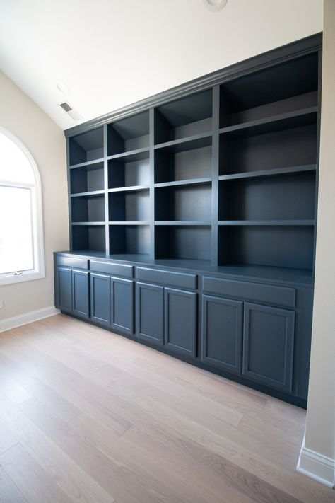 Painting DIY Built-Ins Dark Blue | The DIY Playbook Home Office Built Ins Bookshelf Wall, Office In Dinning Room, Dark Blue Office Cabinets, Home Office Bookcase Wall, Diy Built In Bookcase With Cabinets, Paint Colors For Built In Bookcase, Custom Bookshelf Ideas, Dark Blue Bookcase, Dark Painted Built Ins