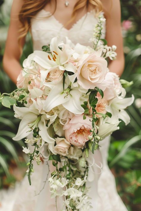 43+ Cascading Wedding Bouquet Ideas That Exude Romance Wedding Flowers Cascading, Wedding Bouquets Elegant Romantic, Best Bridal Bouquet Flowers, Long Wedding Bouquets Brides, Big Wedding Bouquet Brides, Bridal Bouquet Designs, Bridal Bouquet With Lilies, Wedding Bouquet Beach, Hanging Wedding Bouquets