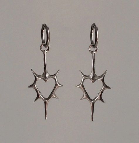 Front view of the heart Stellar Edge Earrings in a gray background Alt Earrings Aesthetic, Gothic Earrings Aesthetic, Grunge Piercings Ear, Silver Jewelry Women, Silver Gothic Jewelry, Home Made Earrings Ideas, Silver Charm Earrings, Cool Ear Piercings Punk, Cool Silver Jewelry