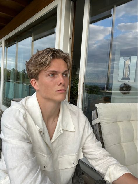 Blonde boy with middle part chilling on the balcony Male Short Middle Part, Old Money Middle Part Hair Men, Hair With Middle Part, Blonde Man Hairstyle, Blond Mens Haircut, Men’s Short Middle Part, Mens Short Middle Part, Men Blonde Hairstyles, Mens Blonde Haircut