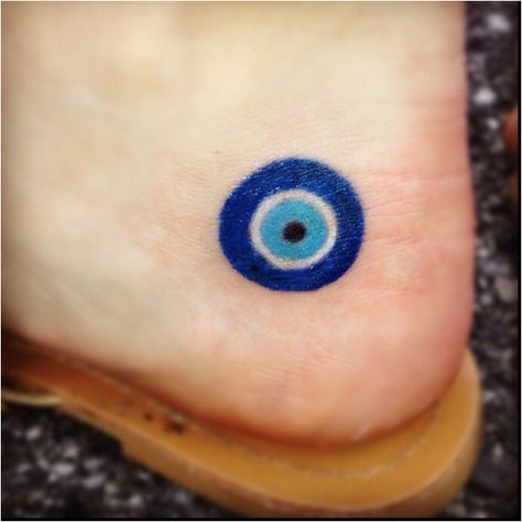 Hamsa or Blue Eye, a Turkish symbol to ward off the evil ~ I have one of these on my fridge that I got in Turkey -MindyFranks Greek Evil Eye Tattoo, Evil Eye Tattoo, Evil Tattoo, Hamsa Tattoo, Blue Tattoo, Greek Evil Eye, Eye Tattoo, It Goes On, Foot Tattoos