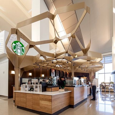 This location celebrates the craft of coffee making. Designer Jon Wagner and fellow designer Jennifer Porteous drew inspiration from the pattern of foamy milk at the top of a latte. #WhereInTheWorld #Padgram Starbucks Interior, Coffee Shop Lighting, Café Starbucks, Cafe Idea, Starbucks Design, Los Angeles Airport, Starbucks Store, Coffee In Bed, Warehouse Conversion