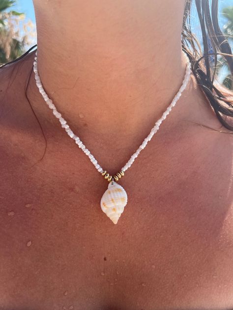 Handmade shell necklace made with Nutmeg shells found here in Southwest Florida! Olive Shells Crafts, Beach Shell Necklace, Homemade Shell Necklace, Shells Jewelry Ideas, Homemade Shell Jewelry, Beaded Necklace With Shell, Shell Jewellery Diy, Sea Shell Jewelry Ideas, Sea Necklace Aesthetic