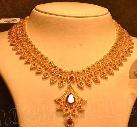 Beautiful uncut diamond necklace with leaf pattern, studded with rubies and emeralds by Malabar gold and diamonds. Malabar Gold Jewellery Necklaces, Malabar Gold Jewellery, Ruby Jewelry Necklaces, Uncut Diamond Necklace, Gold Bridal Necklace, Choker Necklace Designs, Gold Necklace Indian, Beautiful Gold Necklaces, Jewellery Necklaces