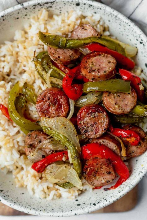 Quick and east sheet pan sausage and peppers are gluten-free and dairy-free. Don't love peppers? This healthy, low-carb, protein-packed meal made with sausage and onions can be served with rice or potatoes, or on its own! Easy Meals Family Of 4, Meals For 200 People, Healthy Husband Approved Meals, Sausage And Pepper Rice Bowl, Simple Healthy Dinner Ideas Clean Eating, Kielbasa And Peppers Recipes, Healthy Polish Sausage Recipes, Paleo Family Meal Plan, Ground Sausage Healthy Recipes