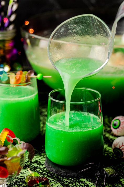 This Halloween Punch is a super easy spooky party drink to make and is always a hit when served at Halloween Parties! This nonalcoholic punch is a favorite amongst kiddos and adults alike! Halloween Alcoholic Punch For A Party, Spooky Drinks Nonalcoholic, Frozen Punch Recipe, Green Drinks Alcohol, Halloween Punch Alcohol, Nonalcoholic Punch, Drinks Nonalcoholic Easy, Halloween Punch For Kids, Party Punch Alcohol