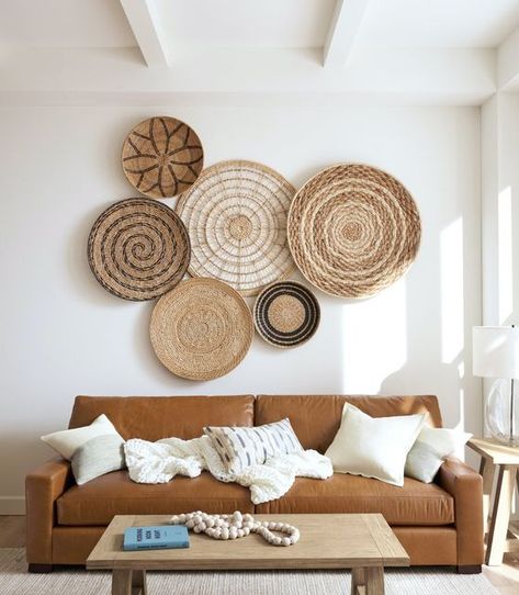 Pottery Barn on Instagram: "Empty wall? Add effortless style with three-dimensional artwork like our Handwoven Basket Wall Art 🙌 Not only do they bring in texture, but the natural material adds warmth to the space as well." Wooden Frames On Wall Home Decor, Woven Baskets On Wall, Basket Wall Decor Modern, Cane Wall Decor, Boho Basket Wall Art, Basket Walls Boho Living Room, Wicker Basket Wall Art, Pottery Barn Wall Art, Basket Walls