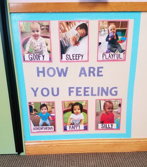 Feelings Wall. Infant classroom. I have feelings unit. Daycare Interactive Wall, Infant Classroom Wall Ideas, Infant Decorations Classroom, Infant Interactive Activities, Baby Room Preschool Ideas, Social Emotional Infant Activities, Infant Classroom Family Wall, Posters For Infant Classroom, I Have Feelings Infant Art