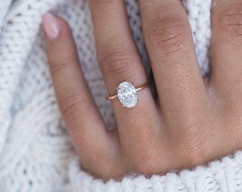 Oval moissanite engagement ring | Etsy CA Oval Moissanite Ring, Moissanite Engagement Ring Solitaire, Dream Engagement Rings, Diamond Solitaire Engagement Ring, Engagement Ring Wedding Band, Blake Lively, Designer Engagement Rings, Oval Diamond, Moissanite Diamonds