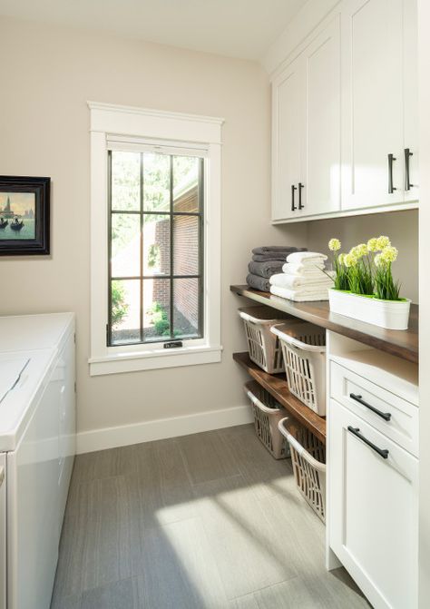 White Laundry Room Cabinets Well-organized & Bright Rooms - Backsplash.com | Kitchen Backsplash Products & Ideas Laundry Washing Basket Storage, Laundry Room Design Folding Counter, Laundry Basket Storage Mudroom, Laundry Organization Containers, Front Loading Laundry Room Ideas, Laundry Room Design Top Loader Layout, White Laundry Room Cabinets, Townhouse Updates, Laundry Room Must Haves