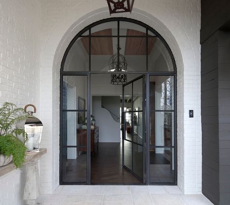 Black Steel Front Door. Arched Black Steel Front Door. Black Steel Front Door and sidelights #BlackSteelFrontDoor #BlackSteelDoor Christopher Architecture & Interiors Campinas, Arched Front Door, Metal Front Door, Steel Front Door, Steel Door Design, Front Door Entrance, Brick Exterior House, Transitional Interior, Arched Doors